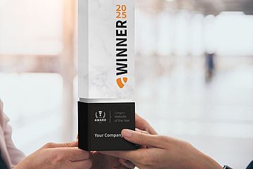 The 2025 TYPO3 Award trophy made of blocks of stone being held by two hands
