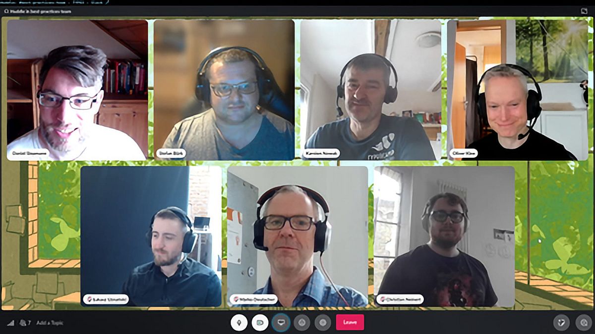 Screenshot of a video call with seven participants.