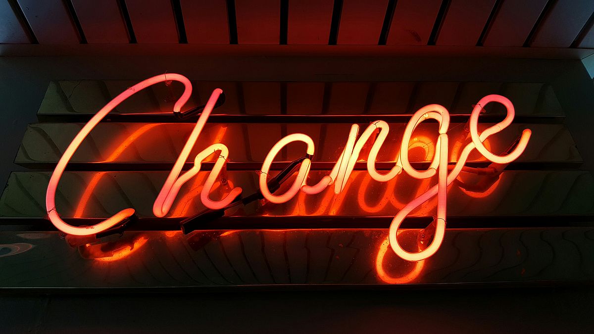 The word "Change" in illuminated orange letters on a black background.