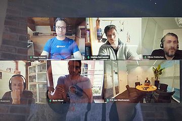 Photo of computer screen showing video meeting.