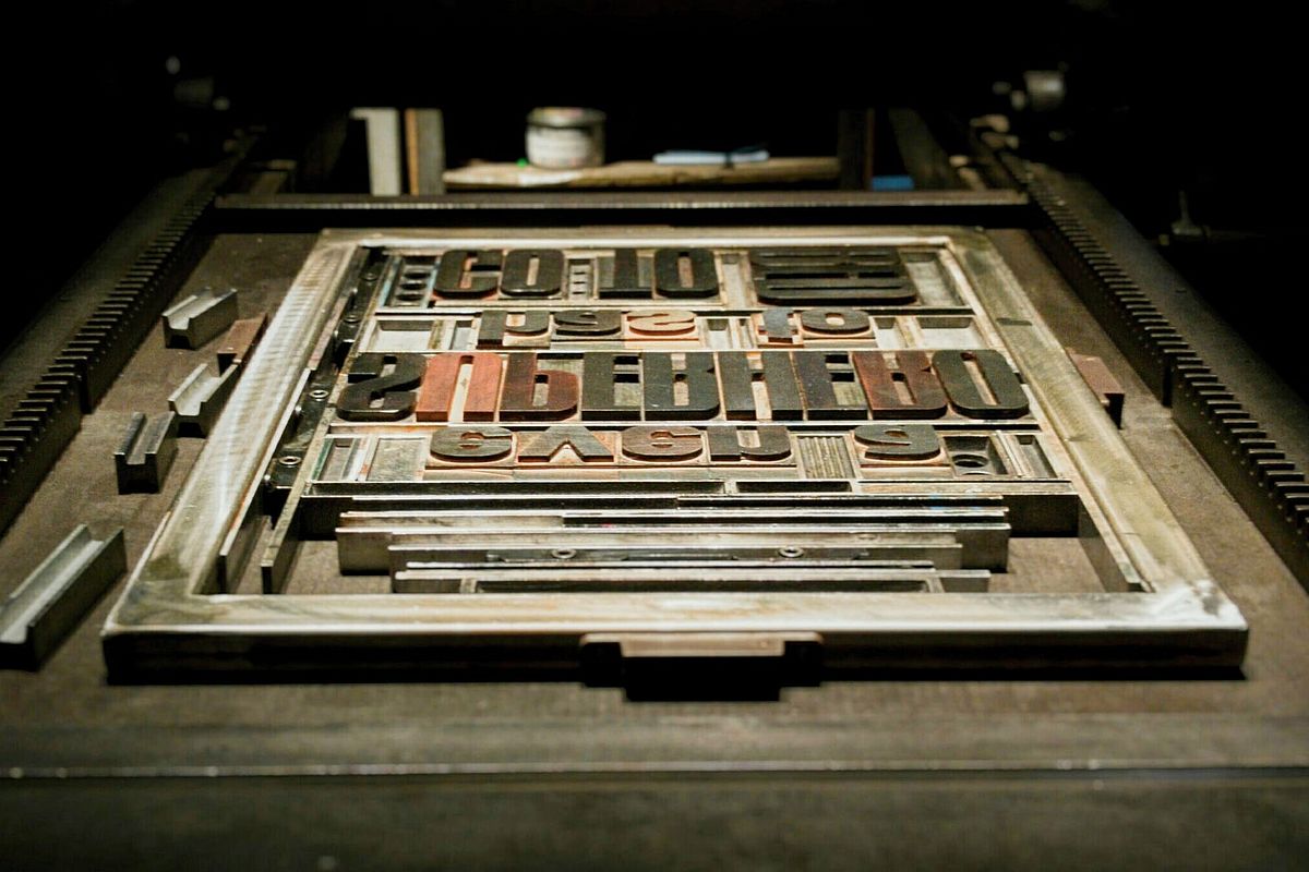 Printing frame with letters spelling out the text "even a superhero has to go to bed"