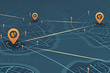 A stylized digital map with orange location pins with the TYPO3 logo connected by glowing lines. The background shows a grid-like layout of streets and water bodies.