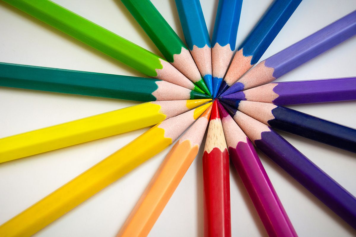 Colored pencils in a circle, tips pointing inward.