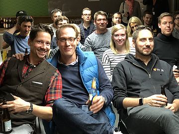 People enjoying themselves at a TYPO3 v9 LTS release party.