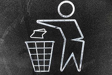 Close up of a recycle garbage bin logo