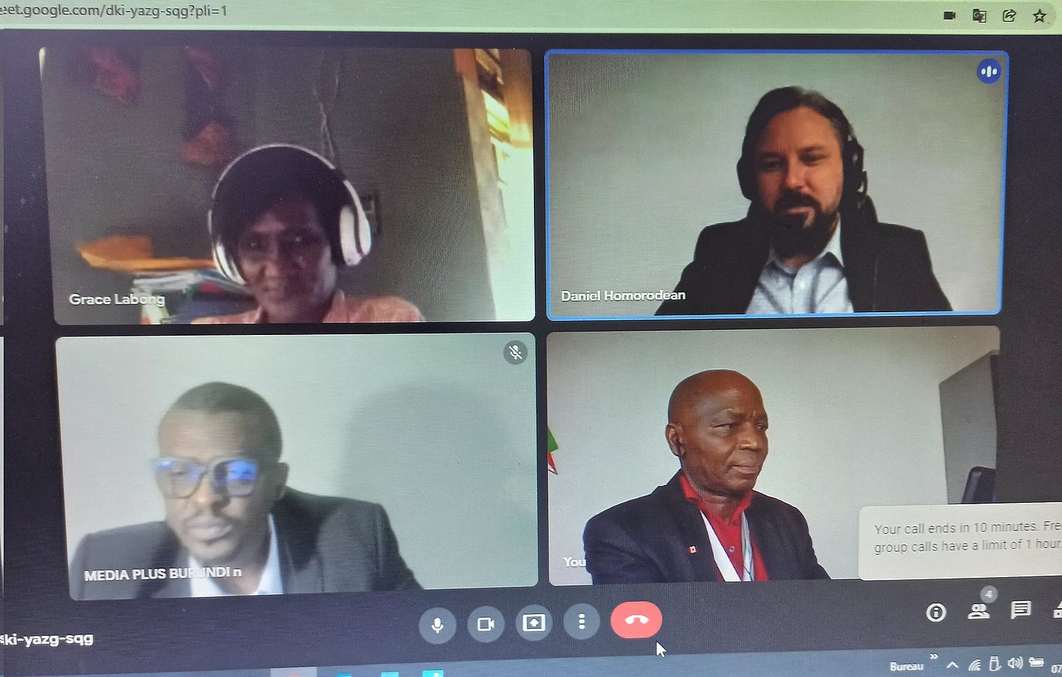 Screenshot of four people in an online meeting.